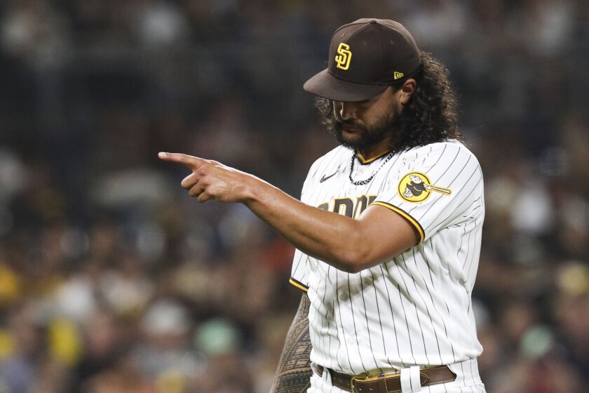 San Diego, CA - October 04: Padres starting pitcher Sean Manaea (55) points to the dugout after getting through the fifth inning against the Giants at Petco Park on Tuesday, Oct. 4, 2022 in San Diego, CA. (Meg McLaughlin / The San Diego Union-Tribune)