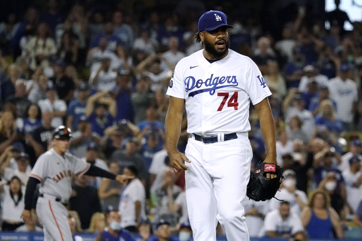 Dodgers relief pitcher Kenley Jansen reacts after walking San Francisco Giants' Darin Ruf with the bases loaded.