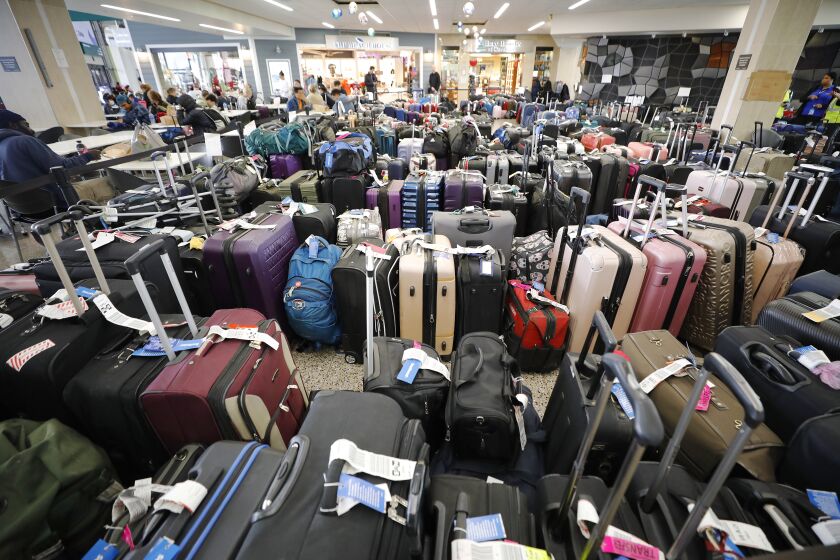 San Diego CA - December 27: A sea of baggage waits to be reunited with their owners at San Diego International Airport after many Southwest Airlines flights were cancelled on Tuesday December 27, 2022. (K.C. Alfred / The San Diego Union-Tribune)