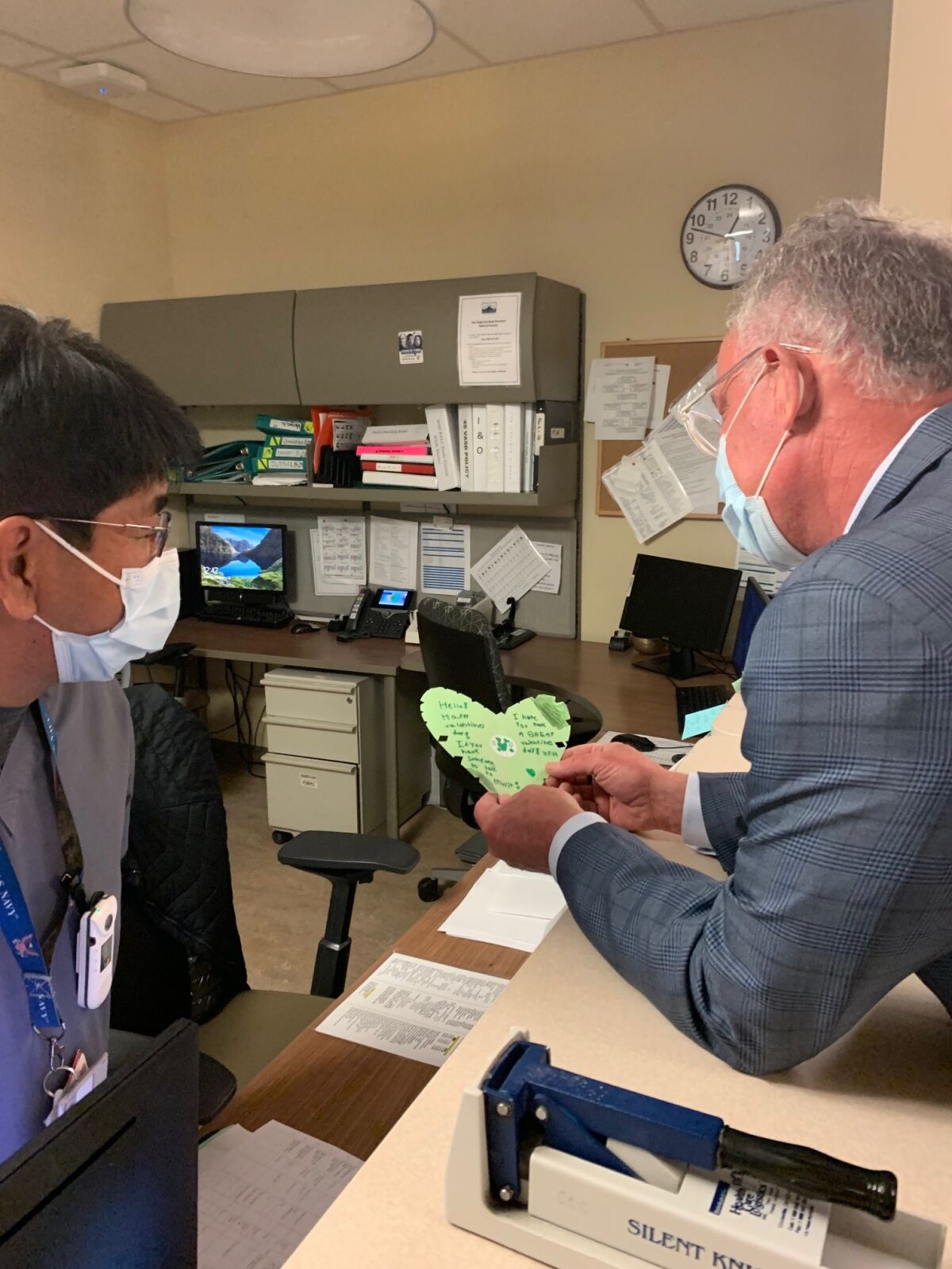 Rep. Scott Peters reads a Valentine's Day card submitted for veterans at the Jennifer Moreno VA Medical Center in La Jolla.