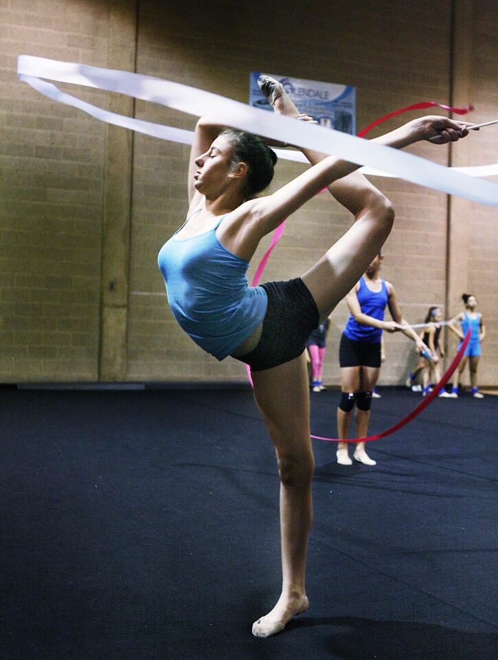 Natalie Bazikyan, 13, of Glendale, practices with the ribbon at the YMCA during the rhythmic gymnastics practice with the advanced class in Glendale.