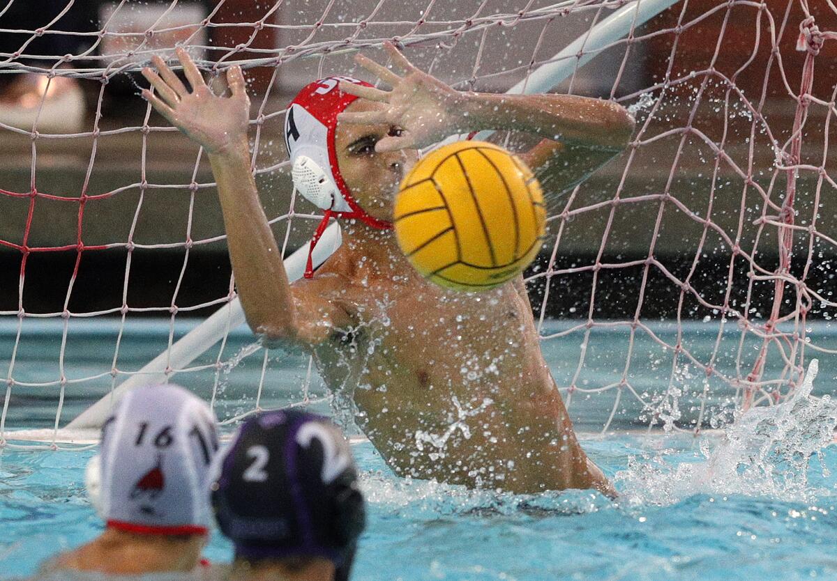 Burroughs' goalie David Karagezyan blocks a Hoover shot on goal in the Pacific League preliminary boys' water polo tournament at Arcadia High School on Tuesday, October 29, 2019. Hoover won the game advancing to the finals.