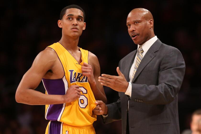 Lakers guard Jordan Clarkson takes instruction from Lakers Coach Byron Scott last month.