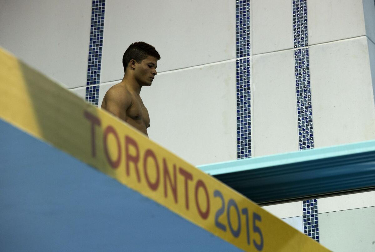 Frandiel Gomez prepares to compete in the men's 3-meter springboard preliminaries at the Pan Am Games in Toronto on Friday.