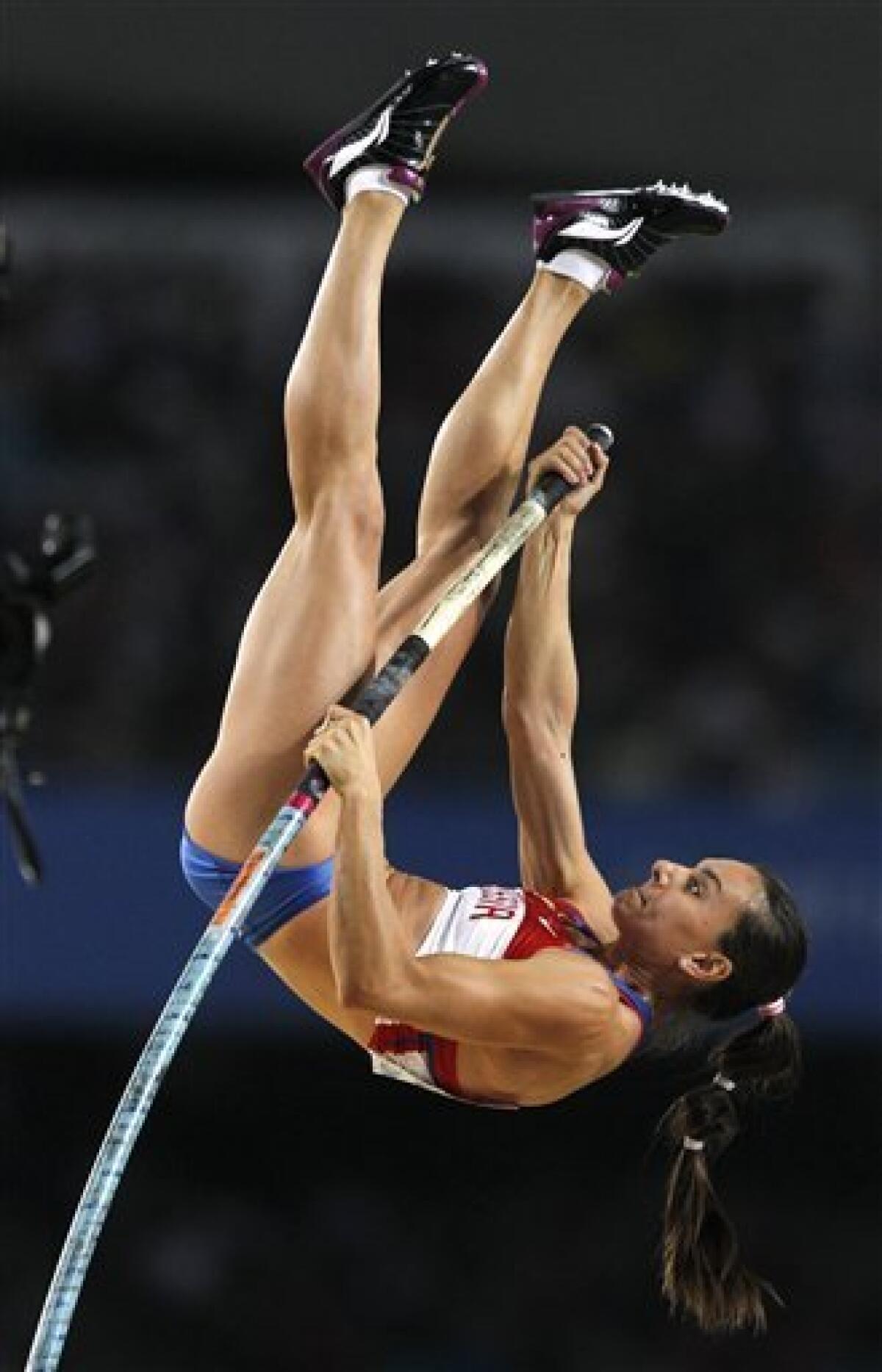 Russia's Yelena Isinbayeva makes an attempt in the Women's Pole Vault final at the World Athletics Championships in Daegu, South Korea, Tuesday, Aug. 30, 2011. (AP Photo/Kin Cheung)