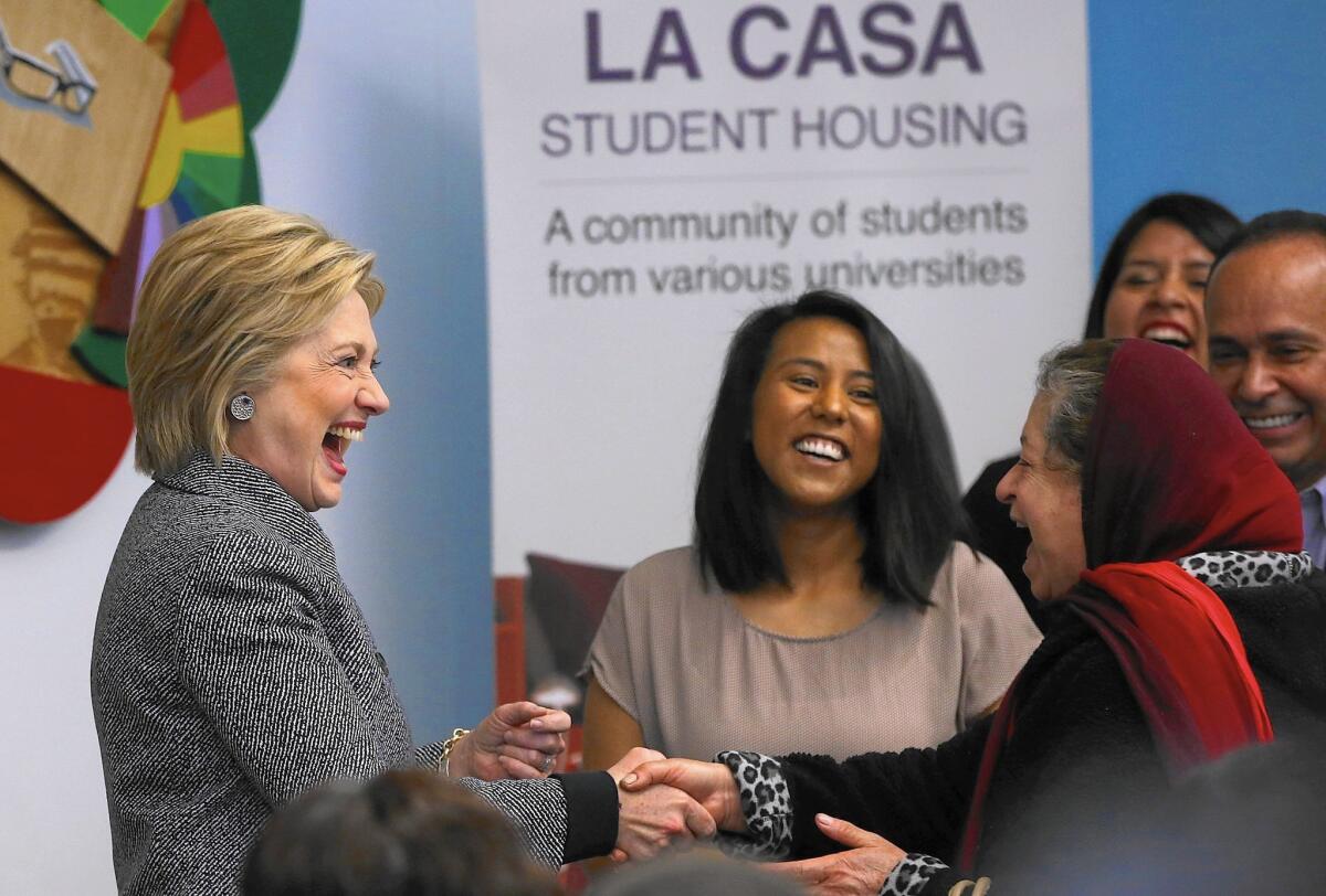 Hillary Clinton greets participants at an immigration workshop in Chicago on March 14. Protests over police violence in the city could indirectly hurt her because of her ties to Mayor Rahm Emanuel.