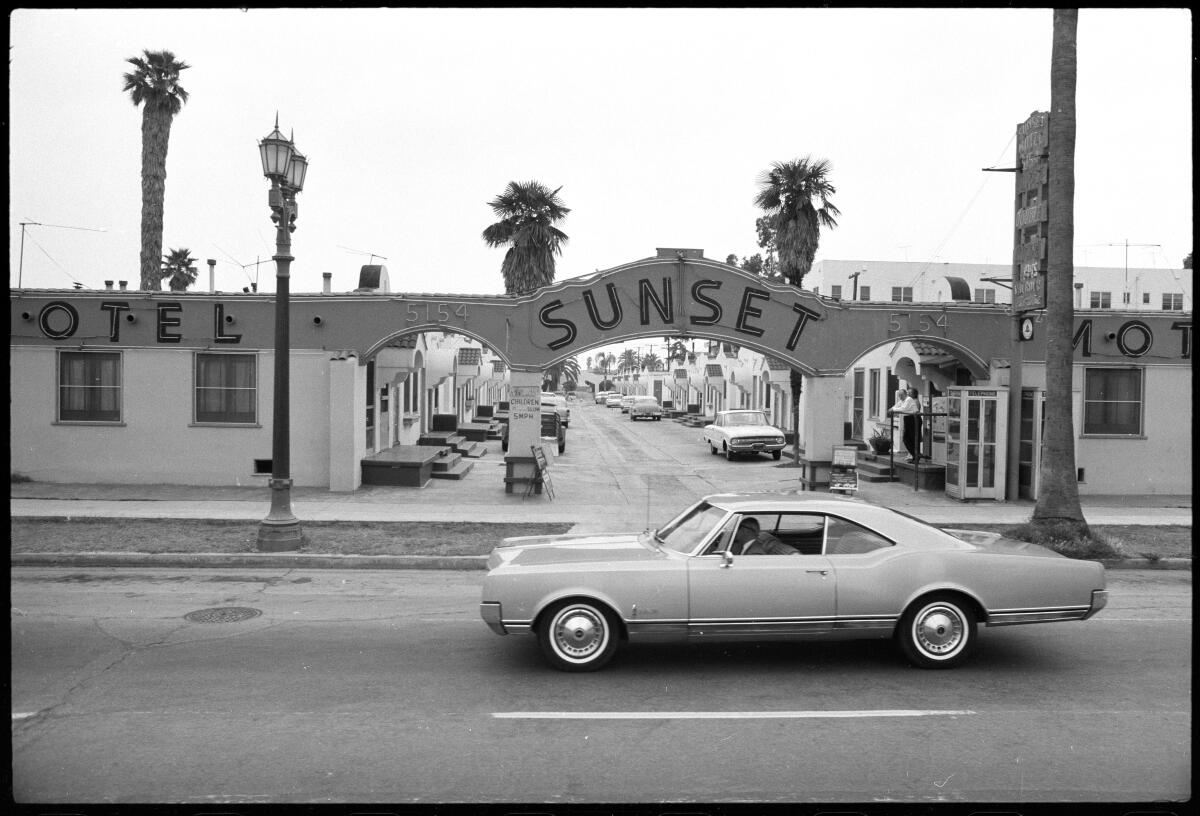 "Sunset Blvd.," 1966, by Ed Ruscha. A vintage car driving before the Sunset Motel
