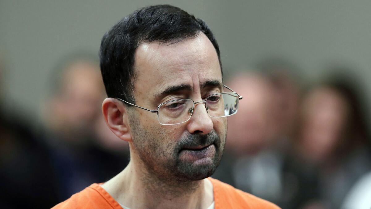 Dr. Larry Nassar appears in court for a plea hearing in Lansing, Mich., in November.