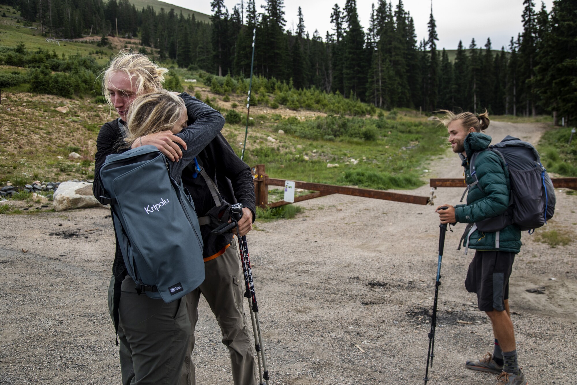 Parell hugs his mother as Potter stands by