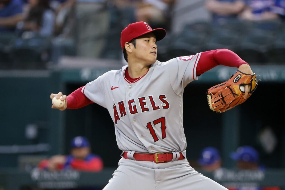 Los Angeles Angels starting pitcher Shohei Ohtani throws to a Texas Rangers batter during the first inning of a baseball game Thursday, April 14, 2022, in Arlington, Texas. (AP Photo/Michael Ainsworth)