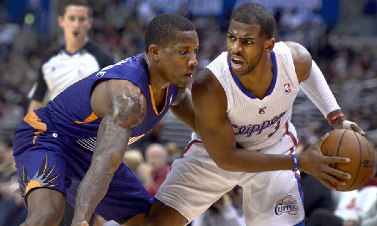 Phoenix Suns point guard Eric Bledsoe, left, defends against Clippers point guard Chris Paul during Monday's game. Bledsoe has shown he's capable of being a full-time starter since being traded by the Clippers to the Suns.