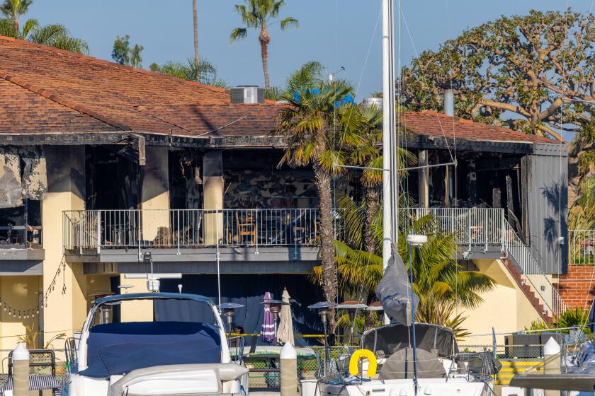 MARINA DEL REY, CA - DECEMBER 12: Two firefighters injured fighting a massive overnight fire that destroyed a decades-old California Yacht Club on Tuesday, Dec. 12, 2023 in Marina Del Rey, CA. (Irfan Khan / Los Angeles Times)