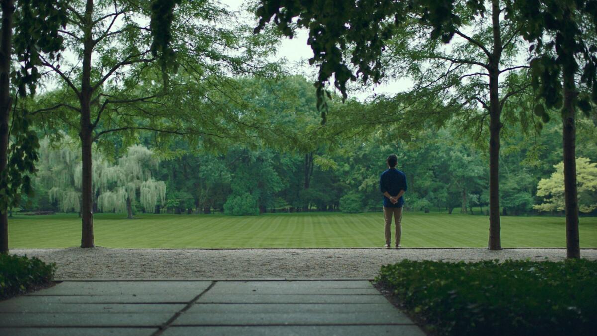 Jin (John Cho) takes in the lush view of the Miller House Gardens in "Columbus."