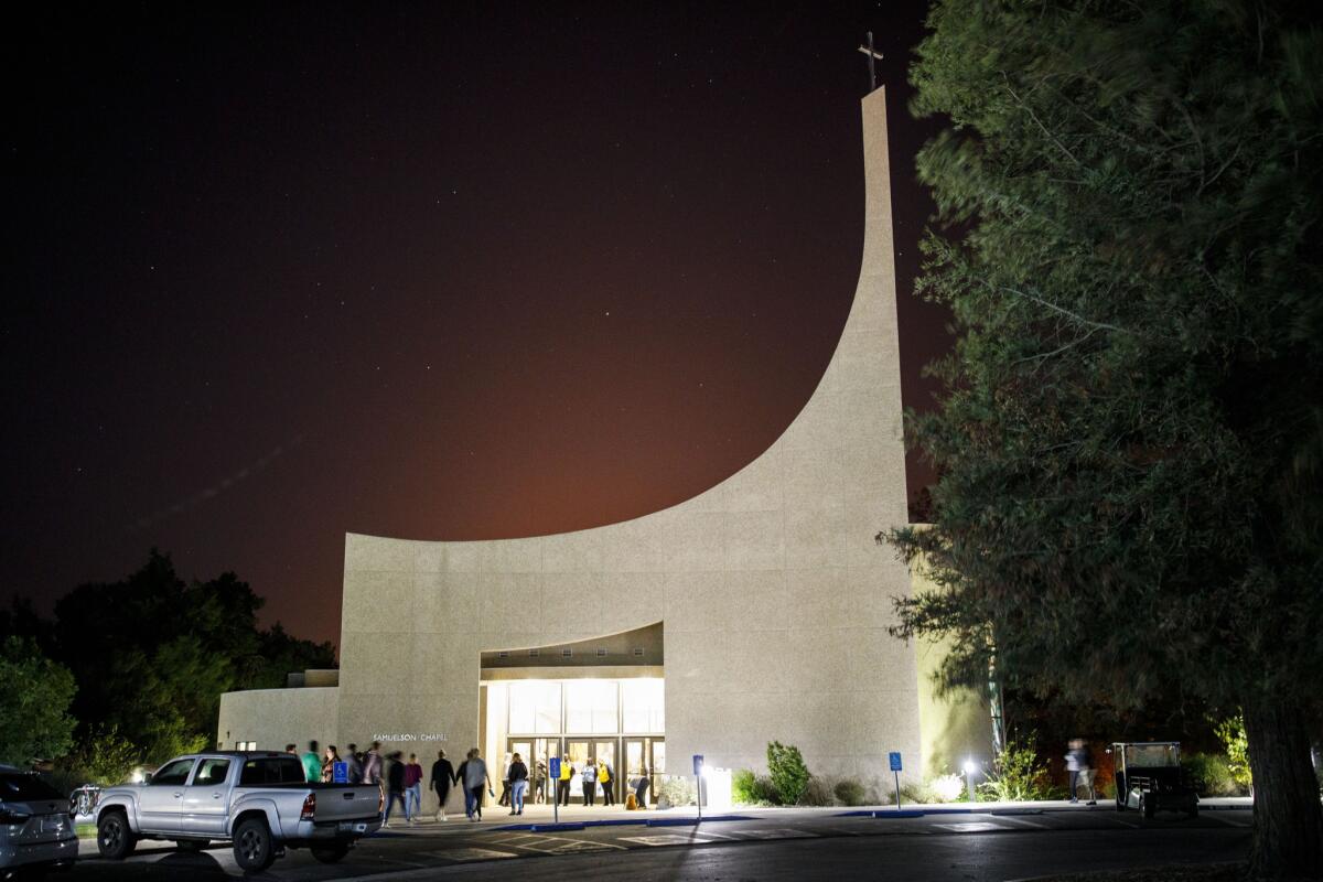 People enter a vigil at the Samuelson Chapel on the Campus of Cal Lutheran University for the victims of the Borderline Bar and Grill shooting on Thursday.