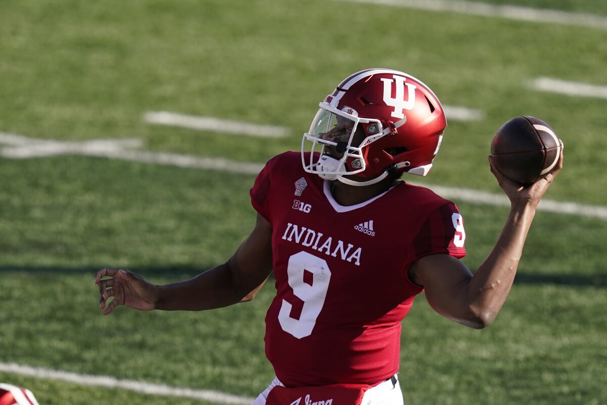 FILE - In this Oct. 24, 2020 file photo, Indiana quarterback Michael Penix Jr. (9) throws during the first half of an NCCAA college football game against Penn State in Bloomington, Ind. Indiana completed its most successful season since the late 1960s but fell short of reaching the Big Ten championship game, a goal they hope to achieve this season. (AP Photo/Darron Cummings, File)