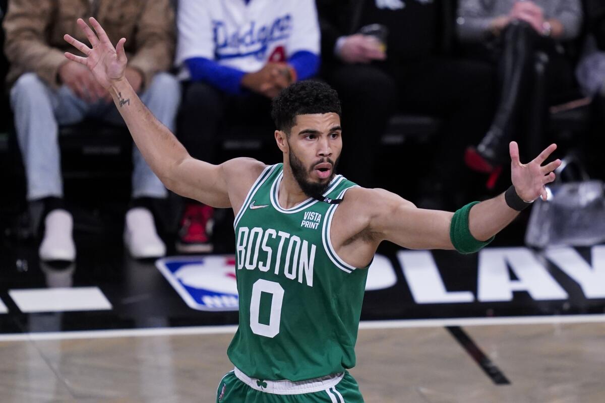Boston Celtics forward Jayson Tatum reacts to a referee's call during the first half of Game 3.
