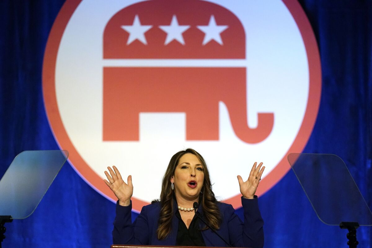 Ronna McDaniel speaks in front of a Republican Party logo.