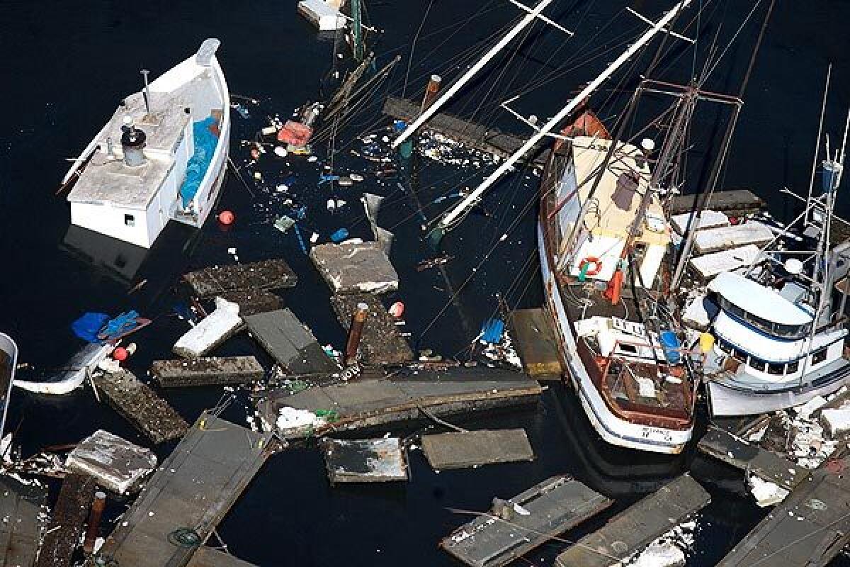 Boats and debris litter the harbor in Crescent City. (Jamie Francis / Oregonian)