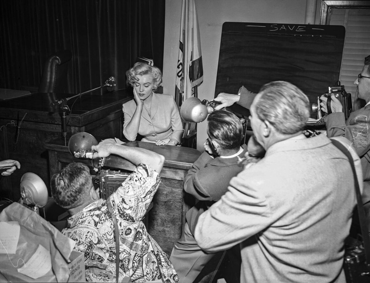 June 26, 1952: Marilyn Monroe is photographed in court.