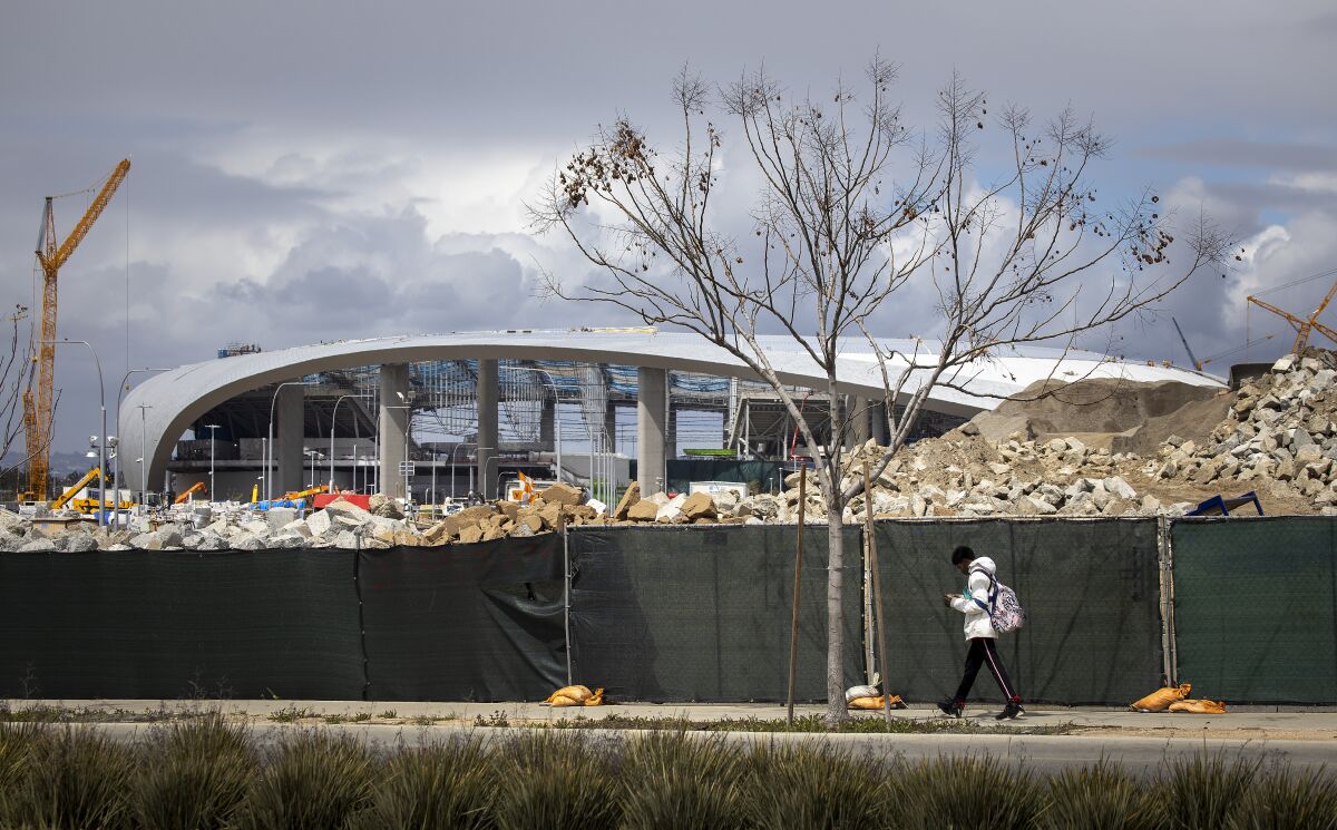 The Chargers will play their first two preseason games at SoFi Stadium, shown under construction on March 19.