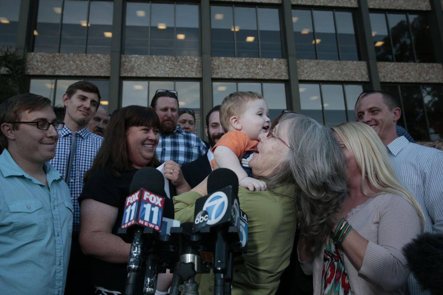 Susan Mellen holds her grandson for the first time after she was released after 17 years in prison.