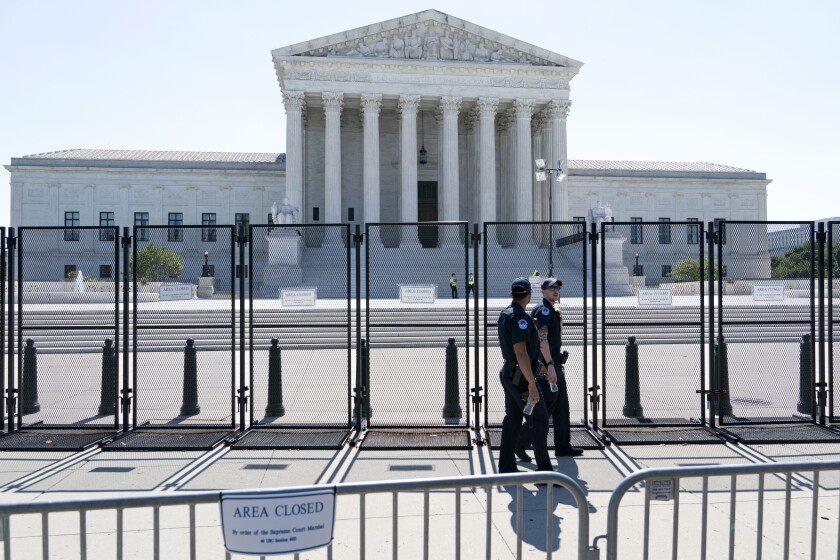 Security works outside of the Supreme Court, Thursday, June 30, 2022, in Washington. (AP Photo/Jacquelyn Martin)