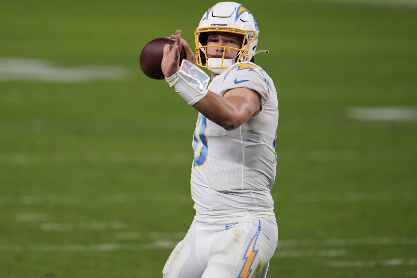 Los Angeles Chargers quarterback Justin Herbert #10 throws a pass during the third quarter against the Las Vegas Raiders in an NFL football game, Sunday, Dec. 13, 2020, in Las Vegas. (AP Photo/Jeff Bottari)