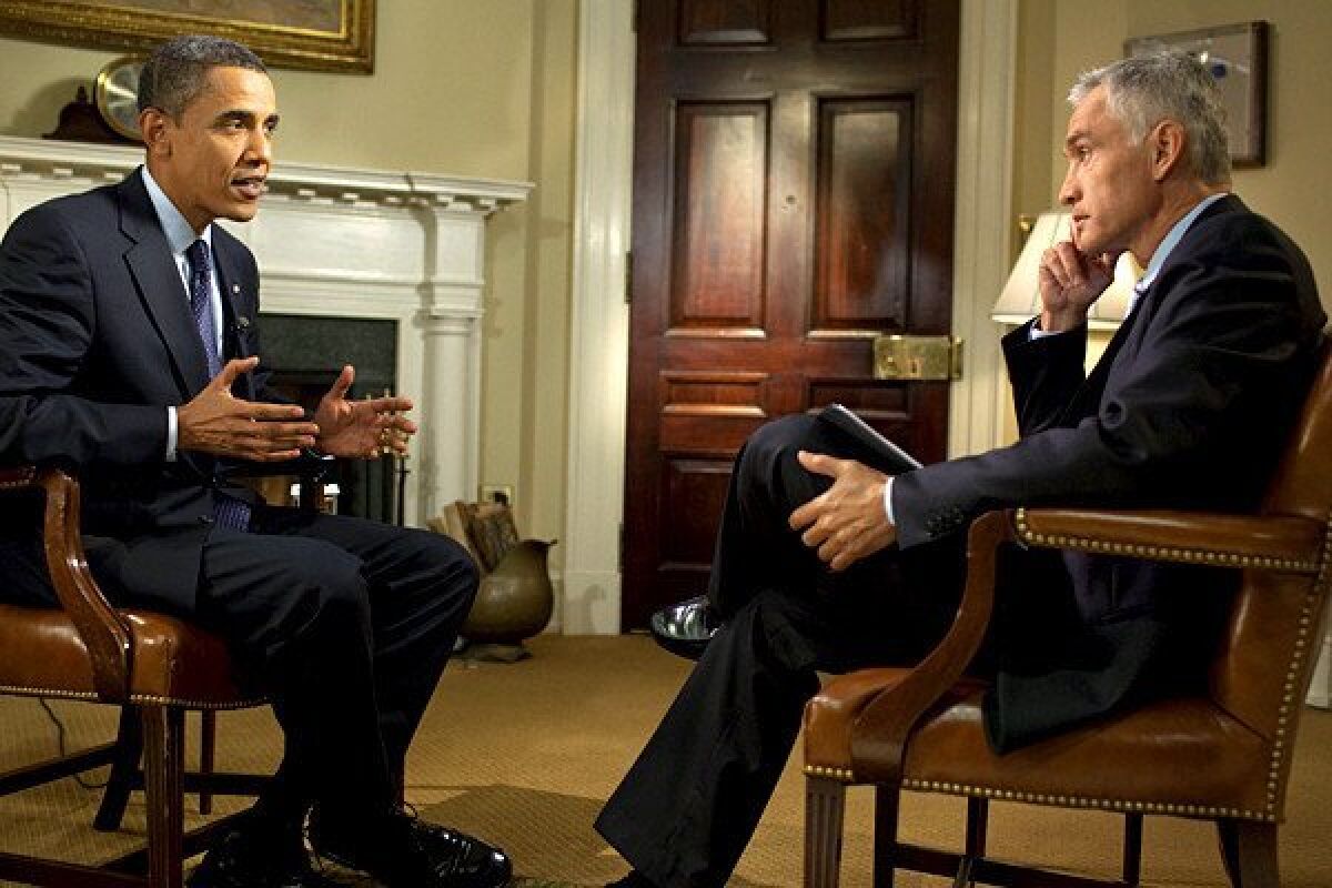 President Barack Obama talks with Univision's Jorge Ramos in the Roosevelt Room of the White House.