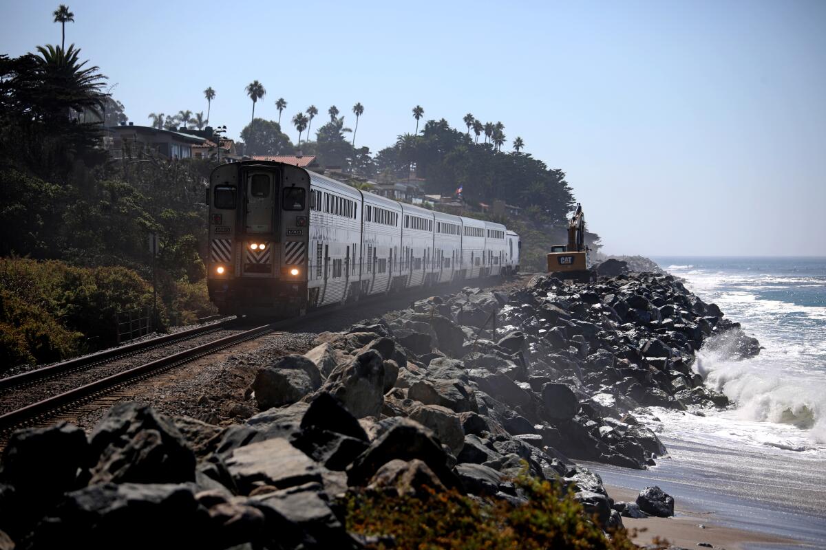 Boulders are in place to protect the rail line and cliffs from further erosion along the coast at San Clemente State Beach 