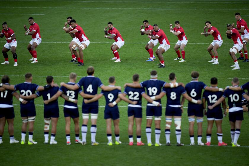 Tonga's players perform a dance prior to the Rugby World Cup Pool B match between Scotland and Tonga at the Stade de Nice, in Nice, France, Sunday, Sept. 24, 2023. (AP Photo/Daniel Cole)