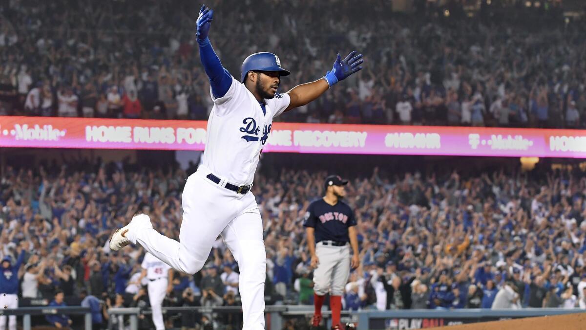 The Dodgers' Yasiel Puig hits a three-run home run against the Boston Red Sox during Game 4 of the World Series on Oct. 27, 2018.