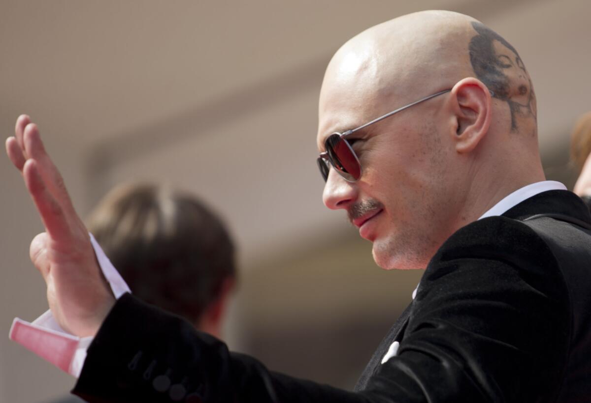 James Franco waves to the audience between takes for his latest film "Zeroville," which were shot at the Venice Film Festival on Friday right before he was presented with the Jaeger-LeCoultre Glory to the Filmmaker 2014 prize.