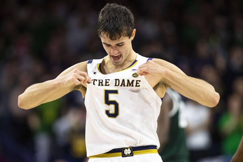 Notre Dame's Cormac Ryan celebrates during the first half of the team's NCAA college basketball game against Michigan State on Wednesday, Nov. 30, 2022, in South Bend, Ind. (AP Photo/Michael Caterina)