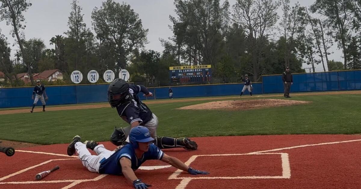 Shane Bogacz of El Camino Real gives a head-first slide to score the game's only run.