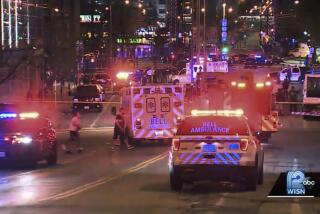 This photo taken from video provided by WISN 12 News shows police responding to the scene of a shooting at Water Street and Juneau Avenue in Milwaukee, Friday, May 13, 2022. Twenty people were injured in two shootings in downtown Milwaukee near an entertainment district where thousands of people were watching the Bucks play the Celtics in the NBA's Eastern Conference semifinals, authorities said. There was no immediate indication whether the two shootings were related or involved fans who were watching the game. (WISN 12 News via AP)
