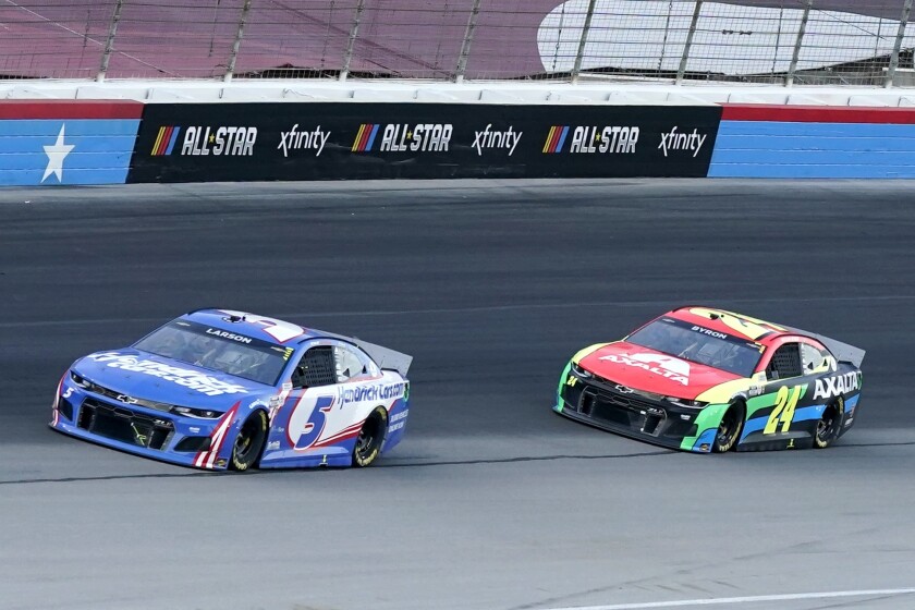 Kyle Larson (5) leads William Byron (24) out of Turn 4 at Texas Motor Speedway in Fort Worth, Texas, on Sunday.