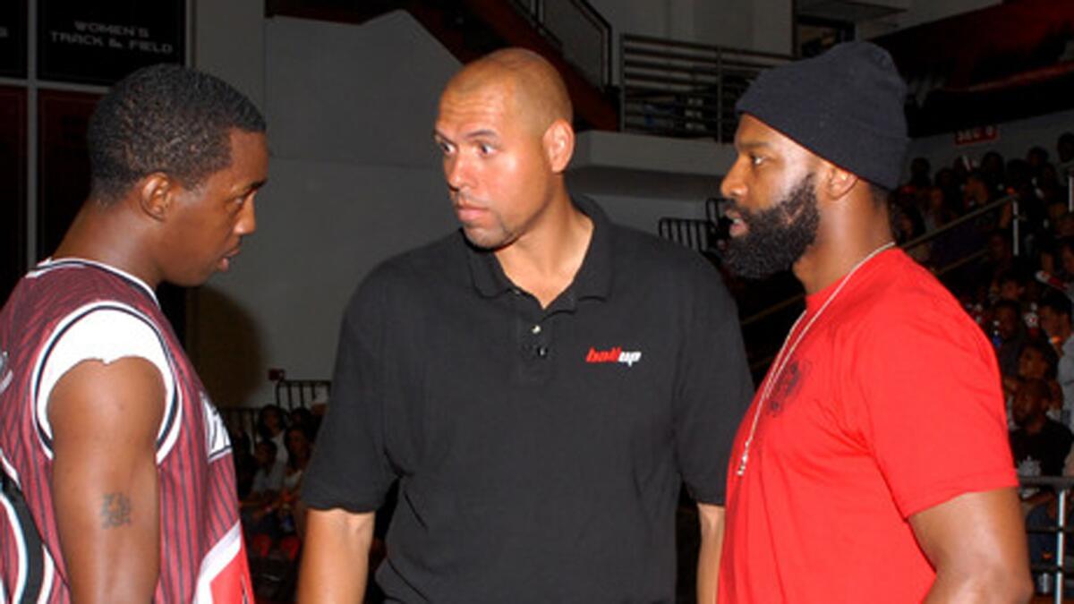 Tracy Murray, center, coaches an all-star team along with Baron Davis, right, during the Ball Up Championship Game at Cal State Northridge on June 24, 2011.