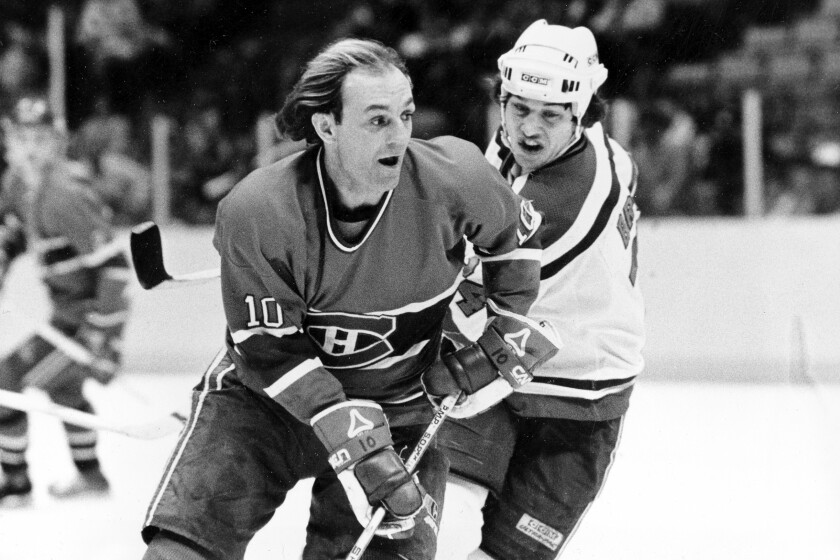 FILE - Guy Lafleur (10) of the Montreal Canadiens cuts in front of Aaron Broten of the New Jersey Devils.