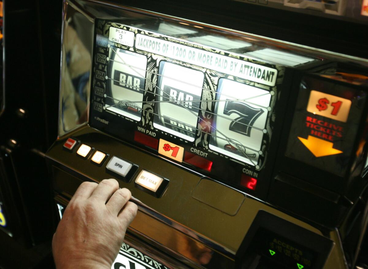 People play the slot machines at a casino near Palm Springs.