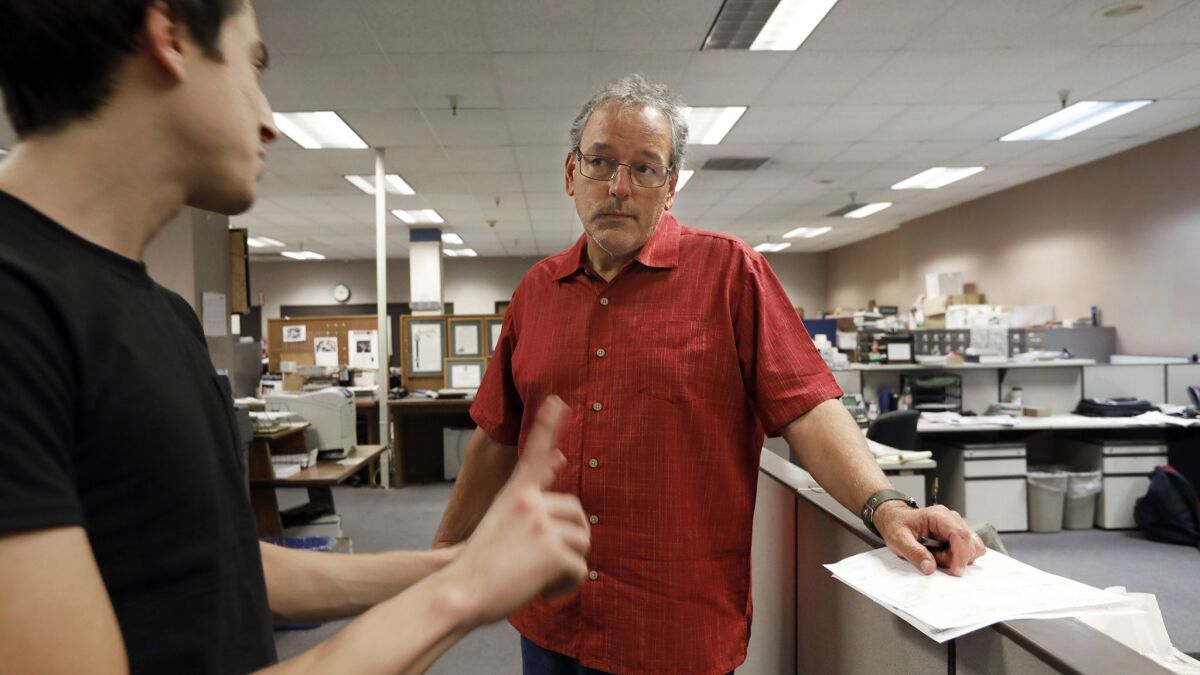David Little, right, editor of the Chico Enterprise-Record and Oroville Mercury-Register, speaks to Dylan Bouscher of the San Jose Mercury News.