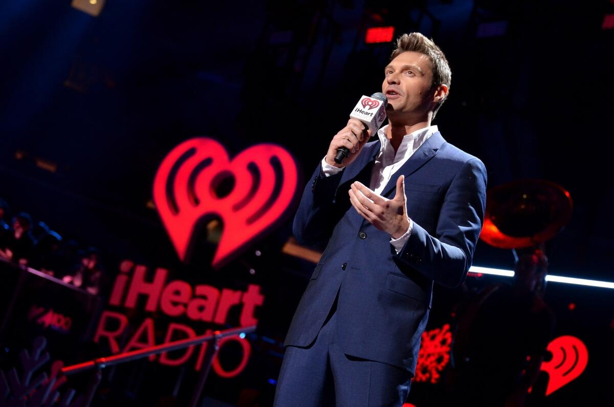 Radio and TV personality Ryan Seacrest speaks onstage at the final stop of the IHeartRadio Jingle Ball tour at Madison Square Garden in New York.