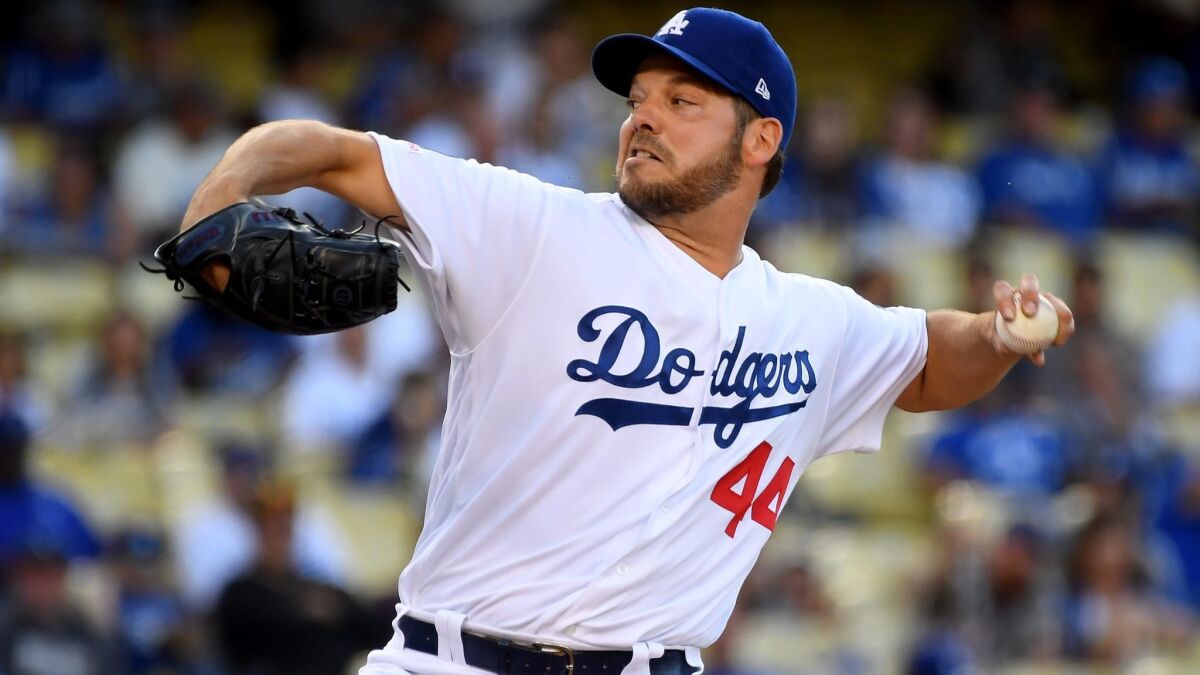 Dodgers pitcher Rich Hill pitches in the first inning against the San Francisco Giants at Dodger Stadium on Wednesday.