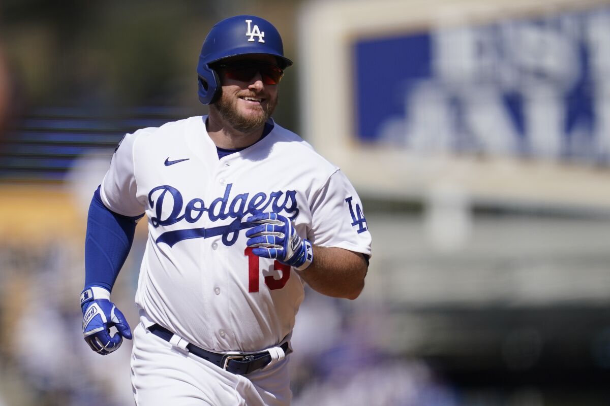 Max Muncy smiles as he runs