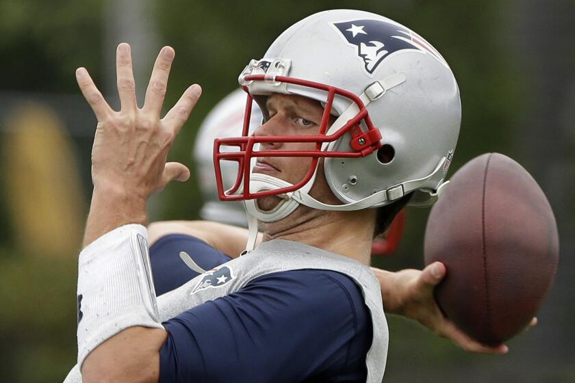New England Patriots quarterback Tom Brady throws a pass during a minicamp training session in Foxborough, Mass., on June 16.