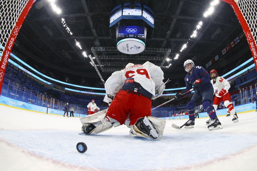 United States' Hilary Knight (21) scores a goal against Russian Olympic Committee goalkeeper Maria Sorokina (69) during a preliminary round women's hockey game at the 2022 Winter Olympics, Saturday, Feb. 5, 2022, in Beijing. (Brian Snyder/Pool Photo via AP)