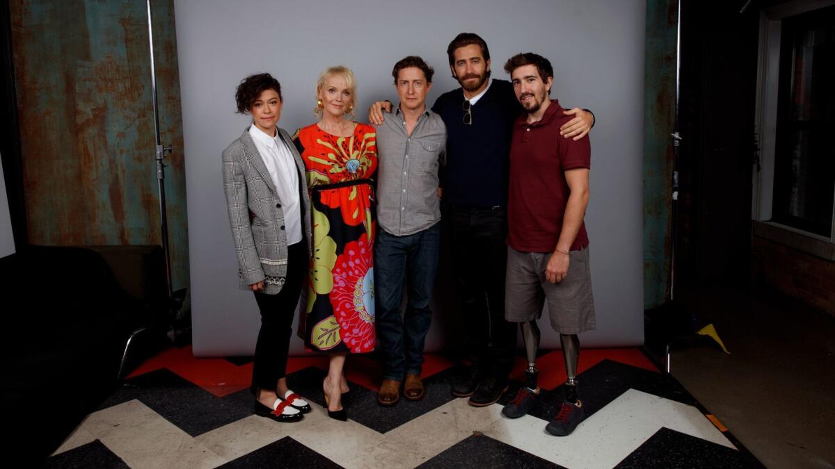 From left: Tatiana Maslany, Miranda Richardson, David Gordon Green, Jake Gyllenhaal, and Jeff Bauman, from the film "Stronger," visit the L.A. Times' photo booth at the 42nd Toronto International Film Festival.