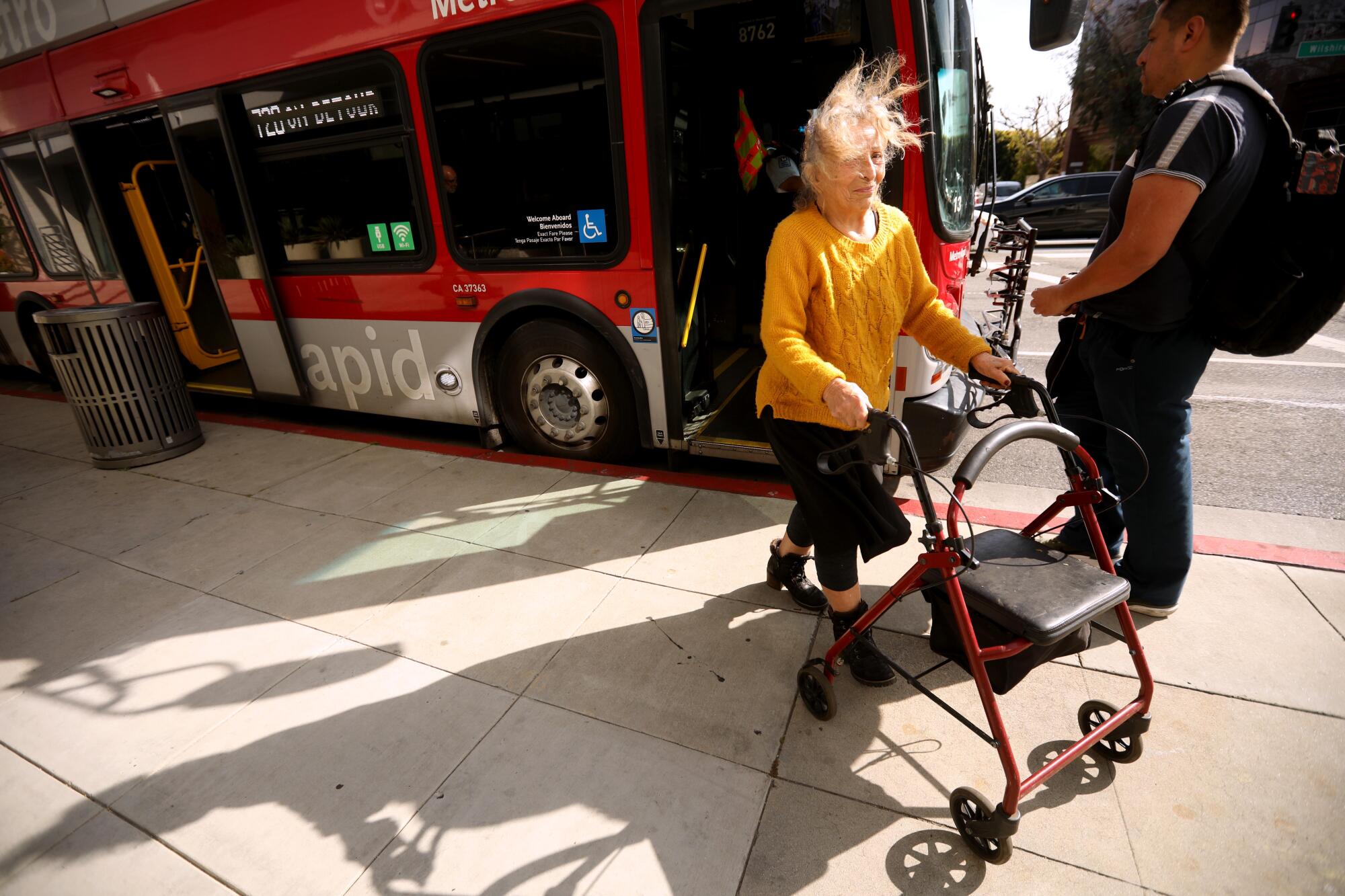 Channah Obadia makes her way off a Metro bus after making a crosstown trip in Los Angeles.
