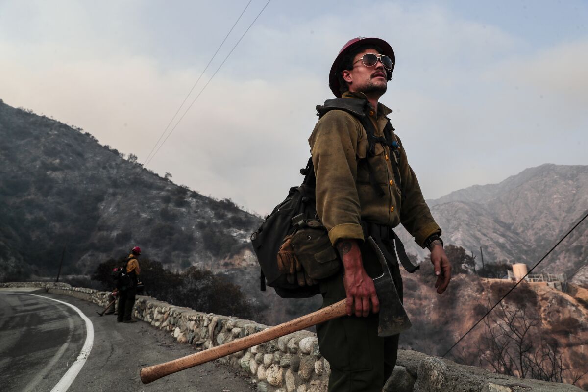Mormon Lake Hotshot Squad leader Jessy Twin, looks over charred hillsides after clearing brush near Chantry Flat Rd.