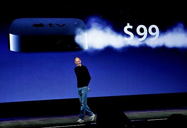 Jobs announces the $99 Apple TV device, with 99-cent online TV show rentals. The majority of Hollywood studios, and two broadcast networks -- CBS and NBC -- declined to allow their shows to be included. "Not all of them wanted to take this step with us," Jobs said. "We think the other studios will see the light."