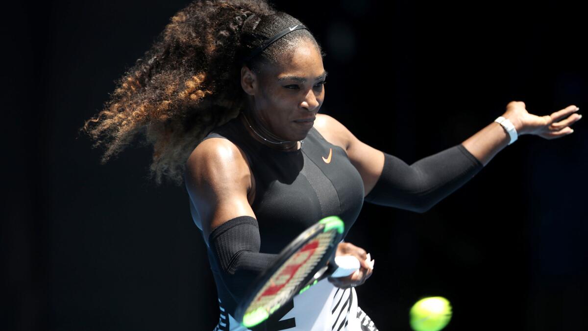 Serena Williams returns a shot against Belinda Bencic during their first-round match at the Australian Open on Tuesday.